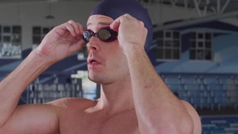 Swimmer-putting-his-pool-goggles-