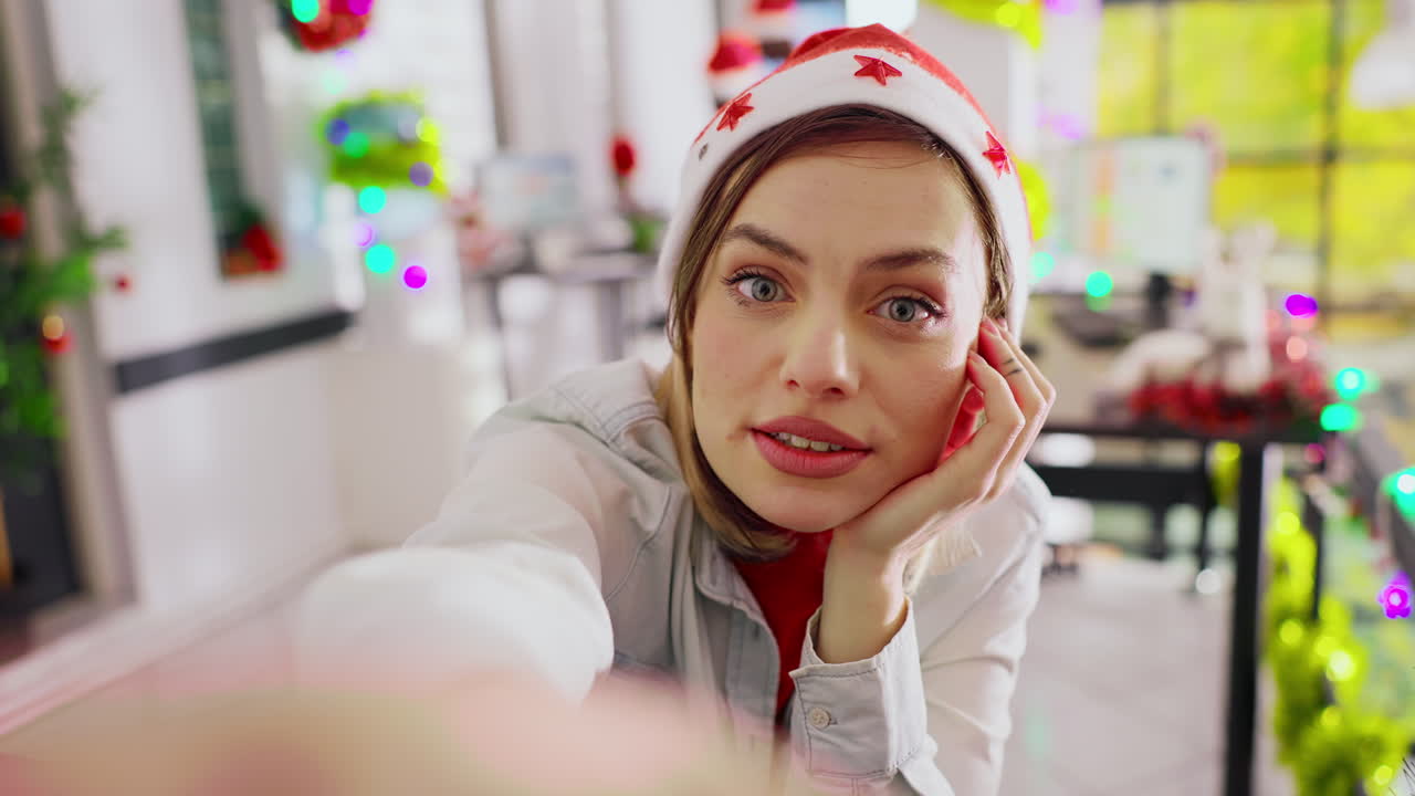 A woman wearing a Christmas hat