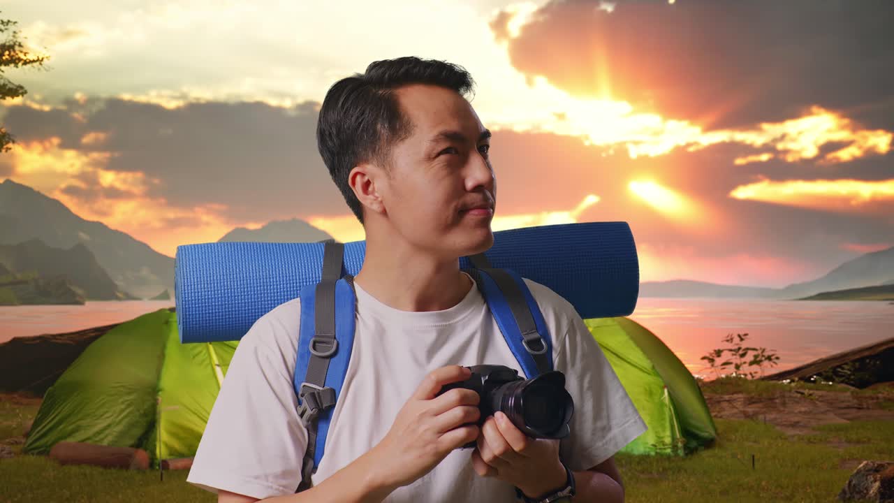 Man taking pictures during a sunset camping trip