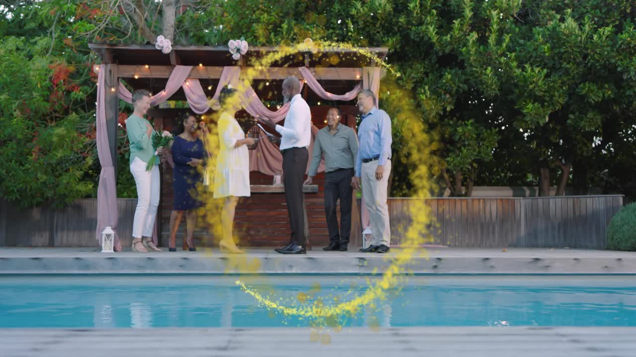 Couple exchanging rings at pergola, golden ring sweeping over stage and pool, marking wedding union