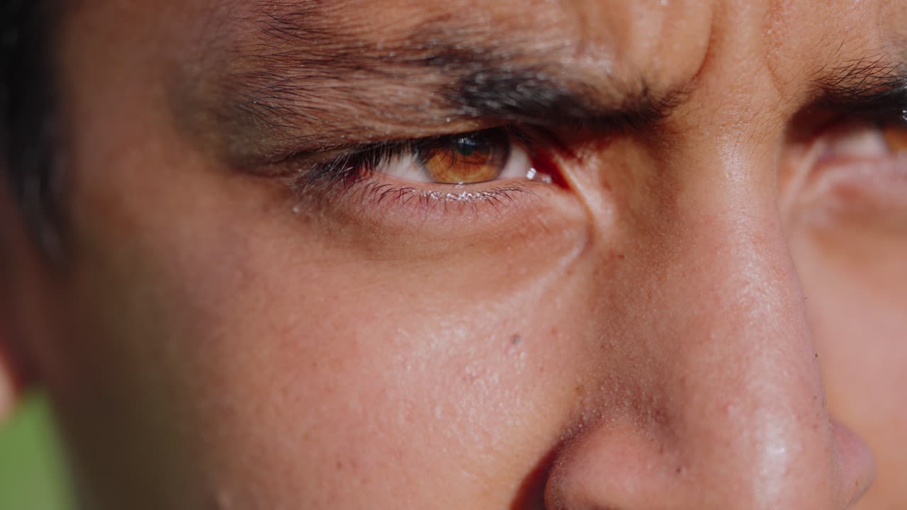 Young boy in rice paddies glancing nervously in different directions, cinematic rural emotion, 4k video