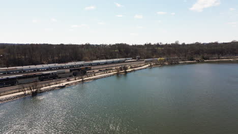 hamilton, ontario, canada - a scenic rail and roadway corridor along hamilton's west harbour, near bayfront park - aerial drone shot
