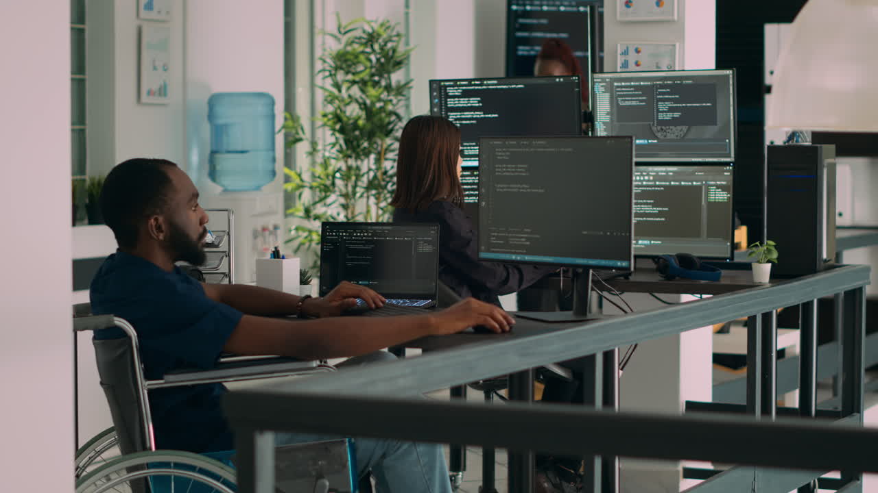 Software developer wheelchair user working on html script code