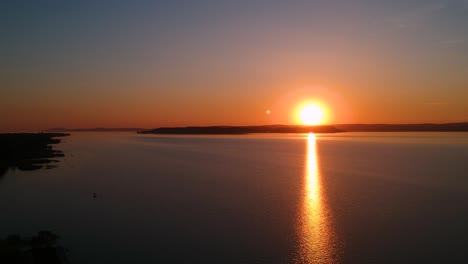 sunset at the lake balaton in spring ,hungary, europe recorded with a dji drone in 1080p full hd