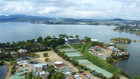 Drone-Flyover-MONA-Museum-Of-Old-And-New-Art-Hobart,-Construction-Architecture-With-River-View,-Tasmania-4K