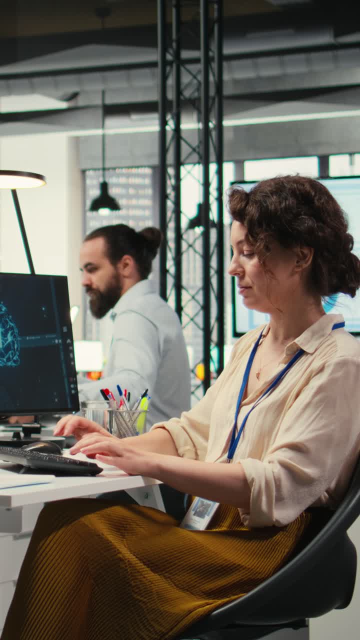 Vertical Video Office administrator checking monthly reports with AI analytics platform