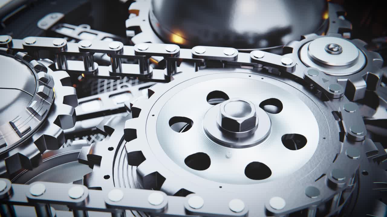 Close-up of Rotating Metal Gears and Chain Mechanism