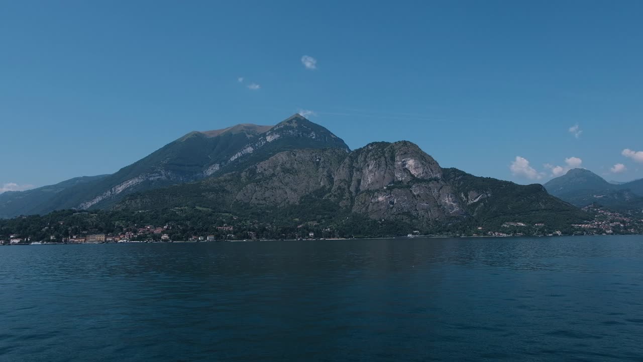 Scenic view of Lake Como with mountains and blue sky