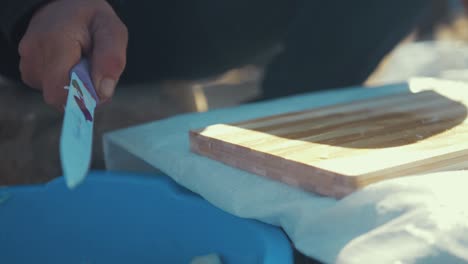 Tight-Shot-of-a-Afghan-Refugee-Slicing-Onions-in-Slow-Motion