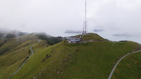 Panoramic drone shot circling the radio transmitter on Te Heru o Kahukura in NZ
