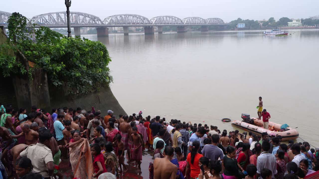 Large Crowd Bathing in a River in India