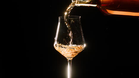 rose orange or white wine bottle and glass against a sunset in a peaceful vineyard, pouring of ecological natural wine. cheers, hands with wine glasses, drinking alcohol.