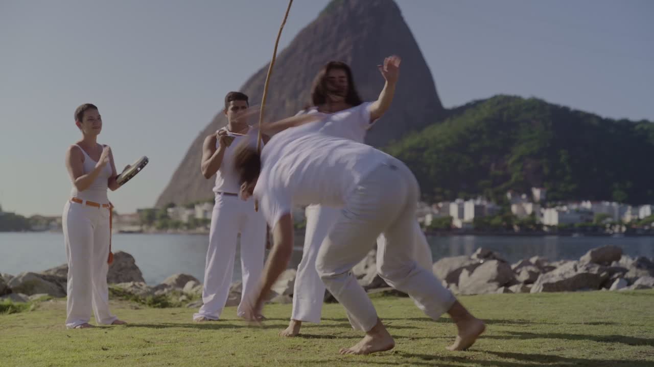 Capoeira performance in a scenic outdoor setting in Brazil