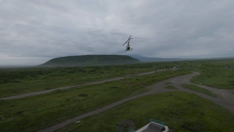 helicopter flight over a remote volcanic landscape