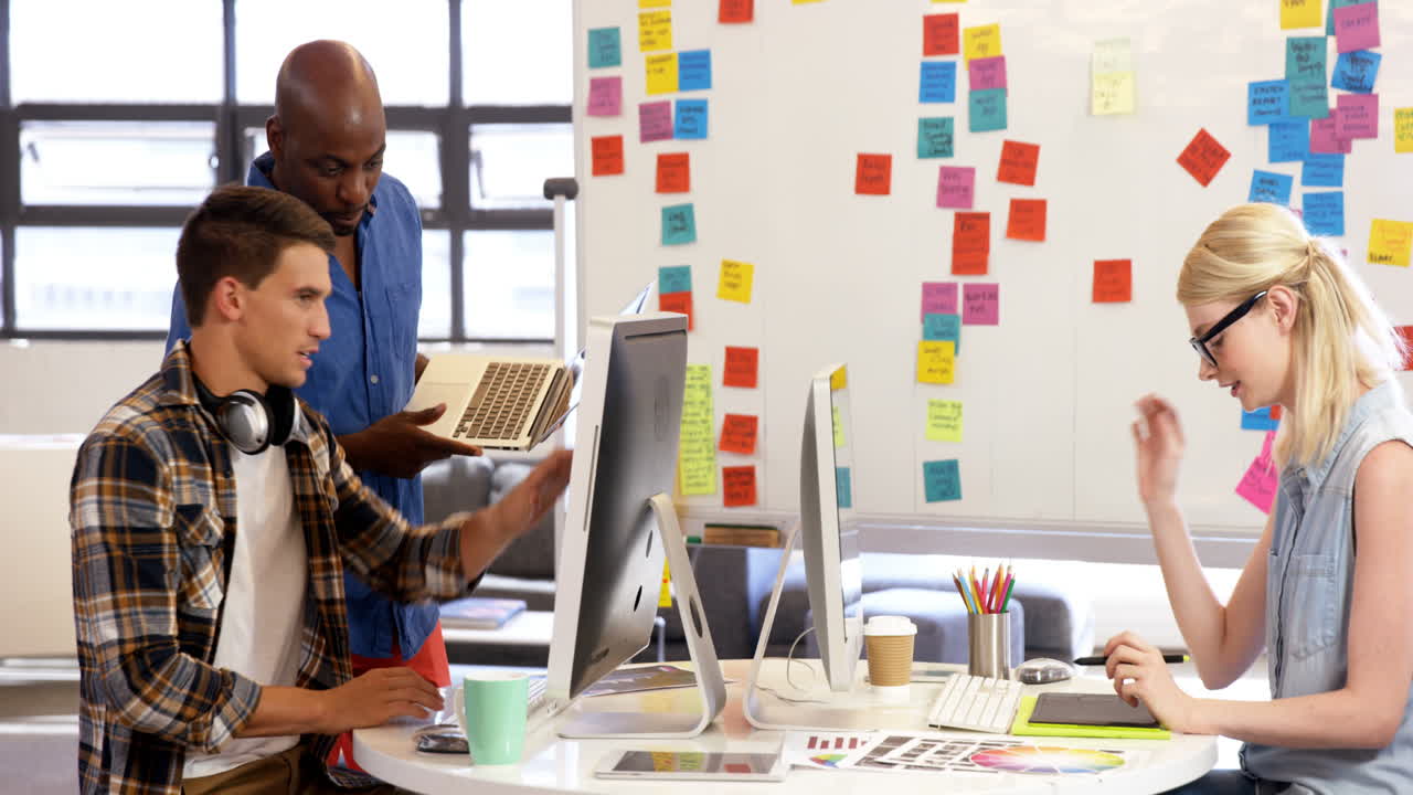 Casual colleagues working with technology