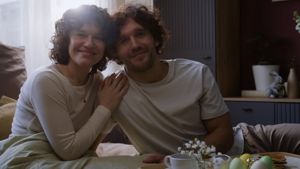 Couple Enjoying Easter Breakfast in Bed