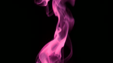 humo rosado que se eleva lentamente giros graciosos hacia arriba. humo de colores que sopla de abajo hacia arriba. primer plano, aislado en fondo negro