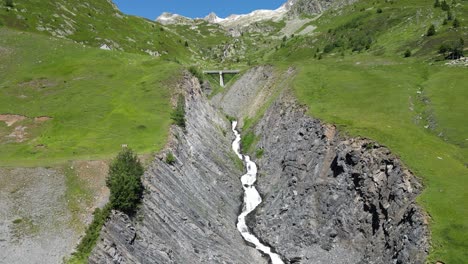 le rieu claret waterfall in french alps, isere savoy, france - aerial dolly forward