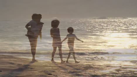 animation of african american family walking at beach over sun on sea