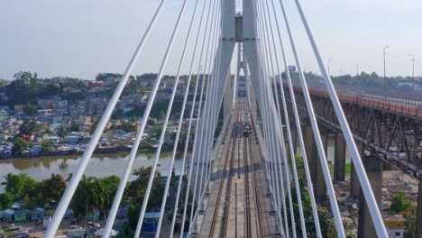 metro train on francisco del rosario sanchez bridge crossing river in santo domingo