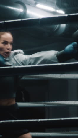 woman boxer training in the boxing ring