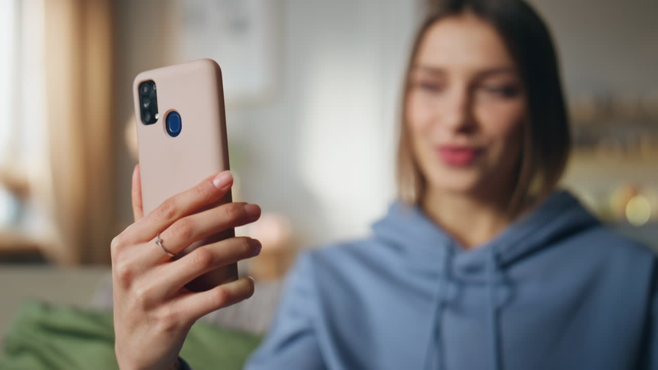 Woman taking selfie with phone