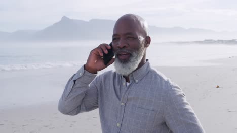 mature man enjoying time outside by the sea