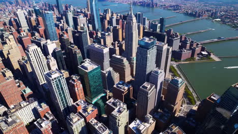 aerial view of a sprawling cityscape with numerous skyscrapers and a river