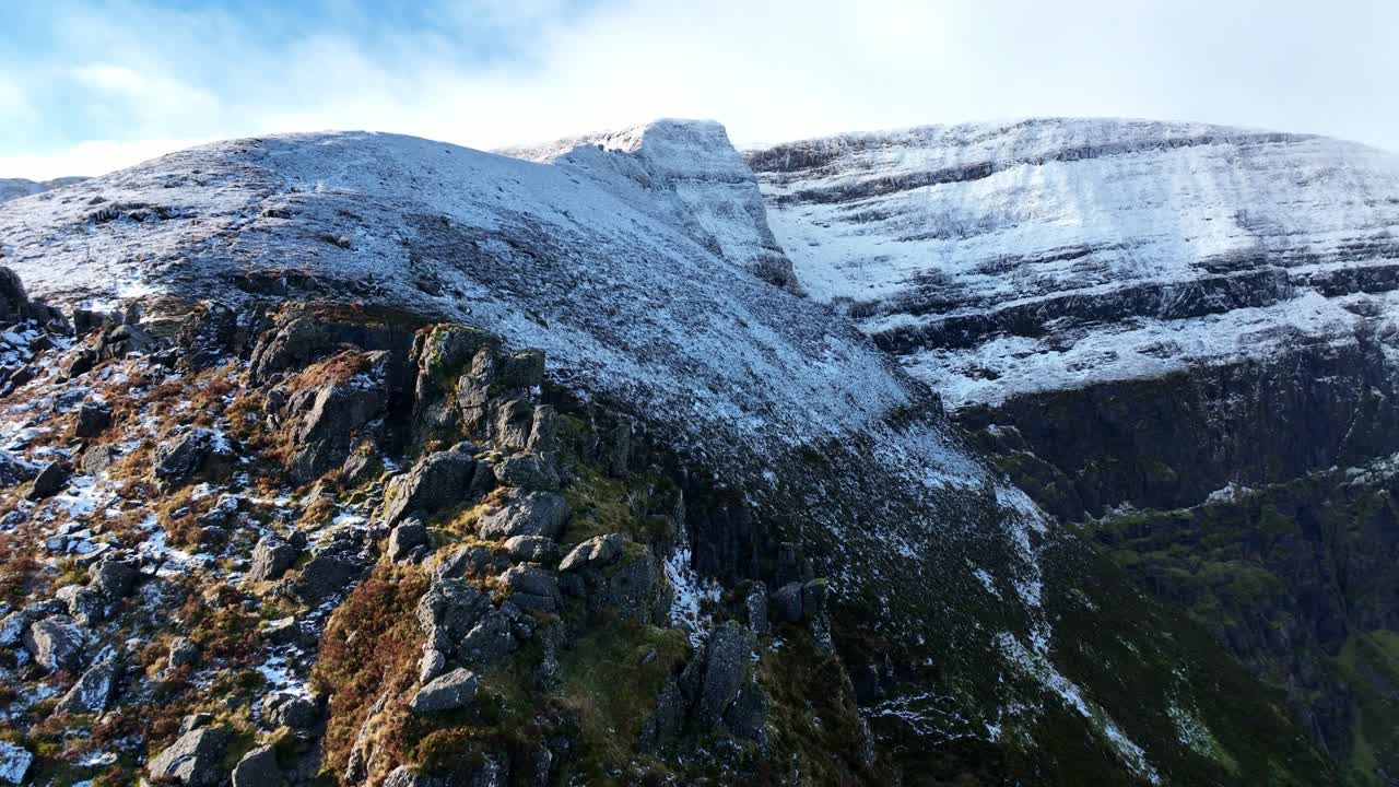 Aerial drone flying up Coumshingaun South Ridge Comeragh Mountains Waterford spectacular winter climbing route