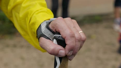 Slow-motion-shot-of-a-trail-runner-grasping-a-pole-at-the-Festival-Des-Templiers