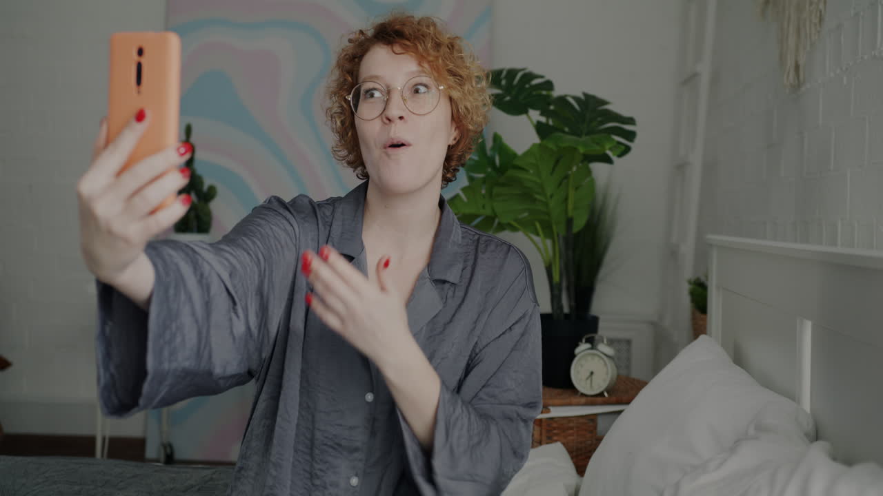 Woman Taking a Selfie in Pajamas