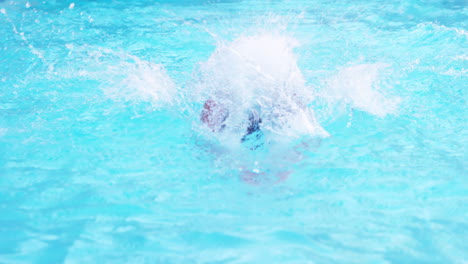 handsome man swimming butterfly stroke