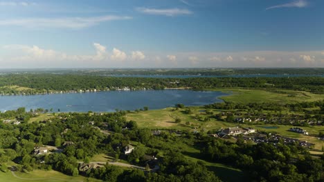 beautiful establishing shot - rural homes big blue lake in background