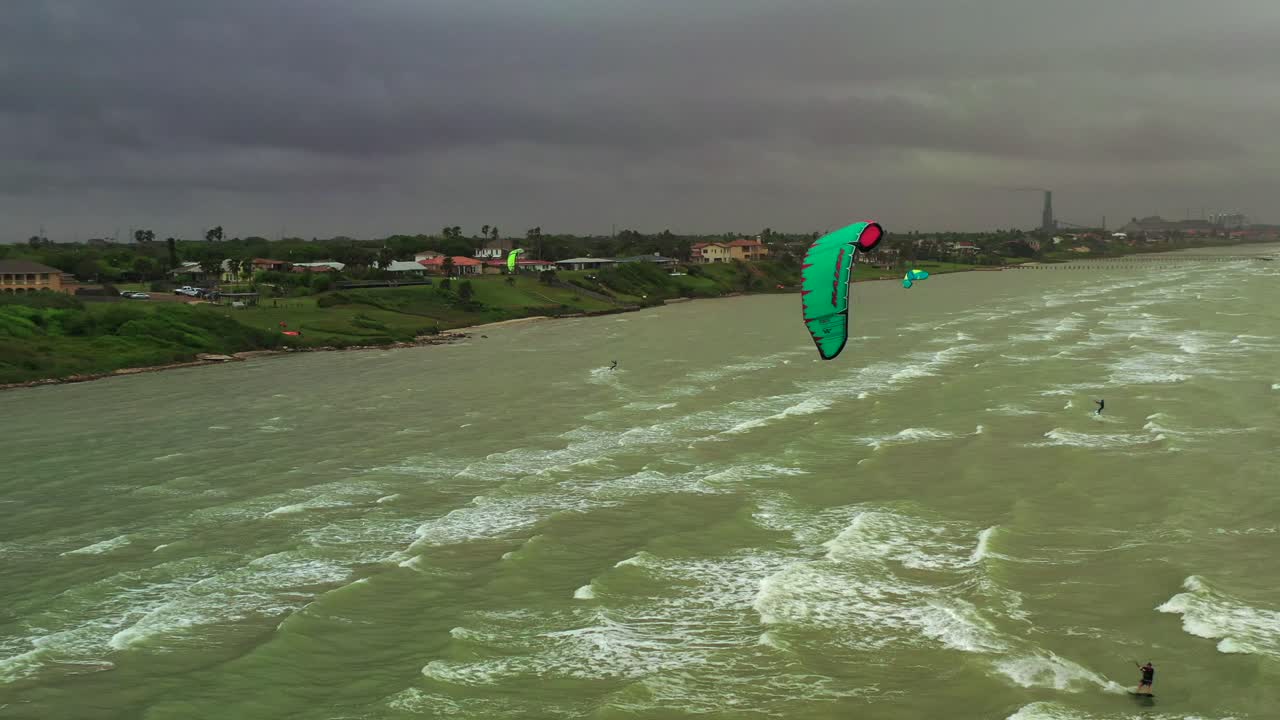 Windy day at Corpus Christi Bay and Kite Surfers taking advantage of the weather
