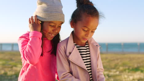 phone, children and friends at the beach