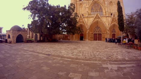 motorcyclist on the square in front of lala mustafa pasha mosque st nicholas cathedral