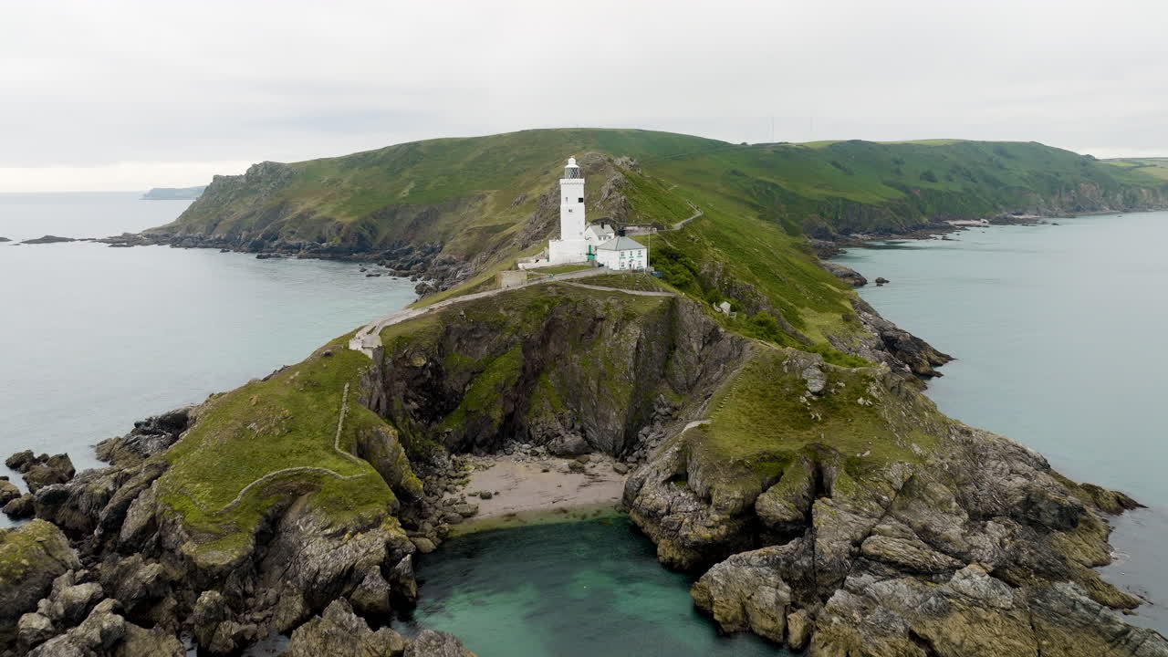 Aerial View of a Lighthouse on a Coastal Cliff