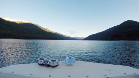 Boat-moving-in-the-river-towards-the-mountain-4k