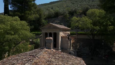 Establishing-panning-aerial-view-of-historical-Temple-of-Clitumnus,-Umbria