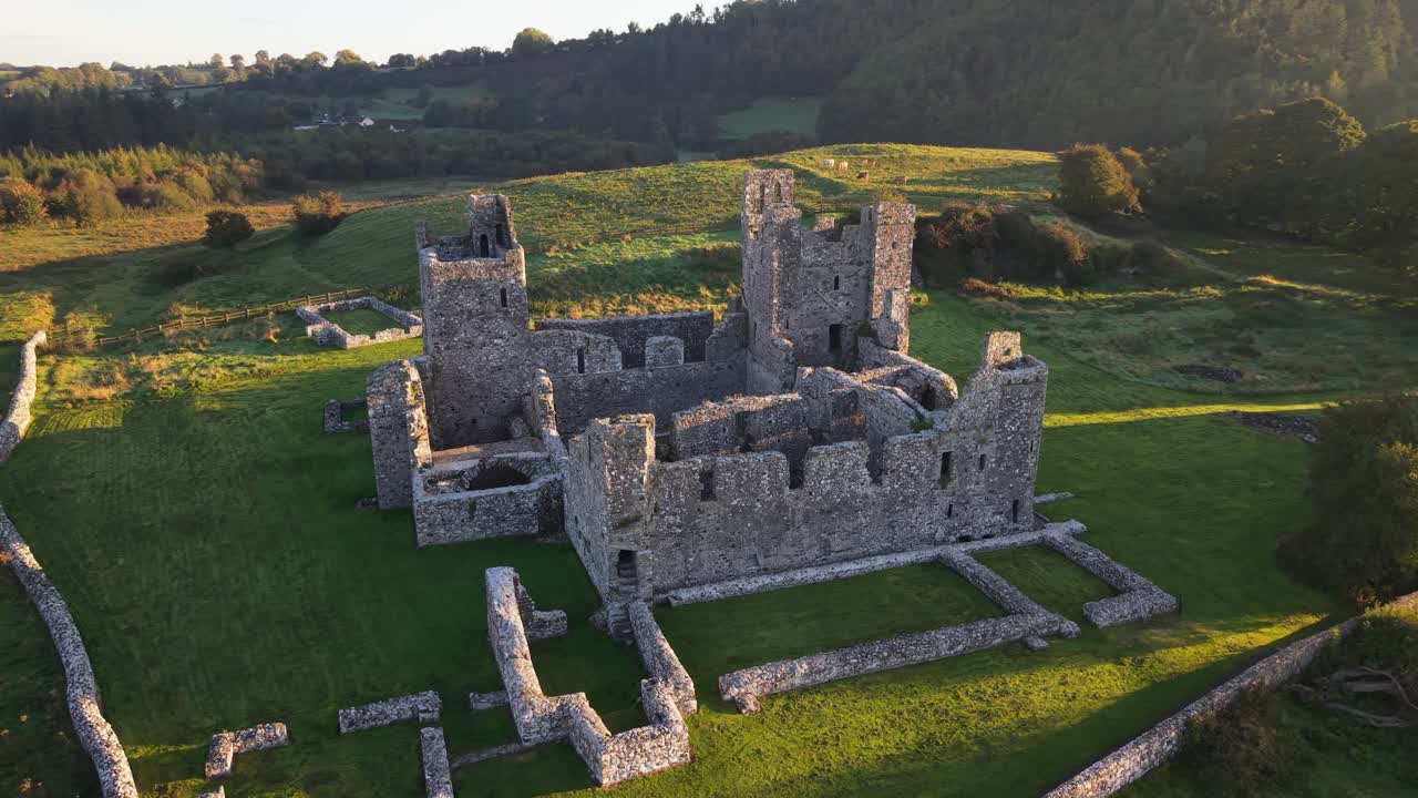The Majestic Towers of Fore Abbey Bathed in Sunset Light on The Irish Countryside