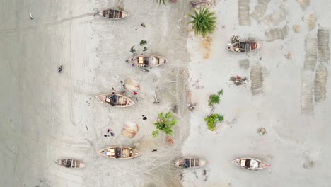 Aerial-top-view-of-boats-kept-idle-on-beach