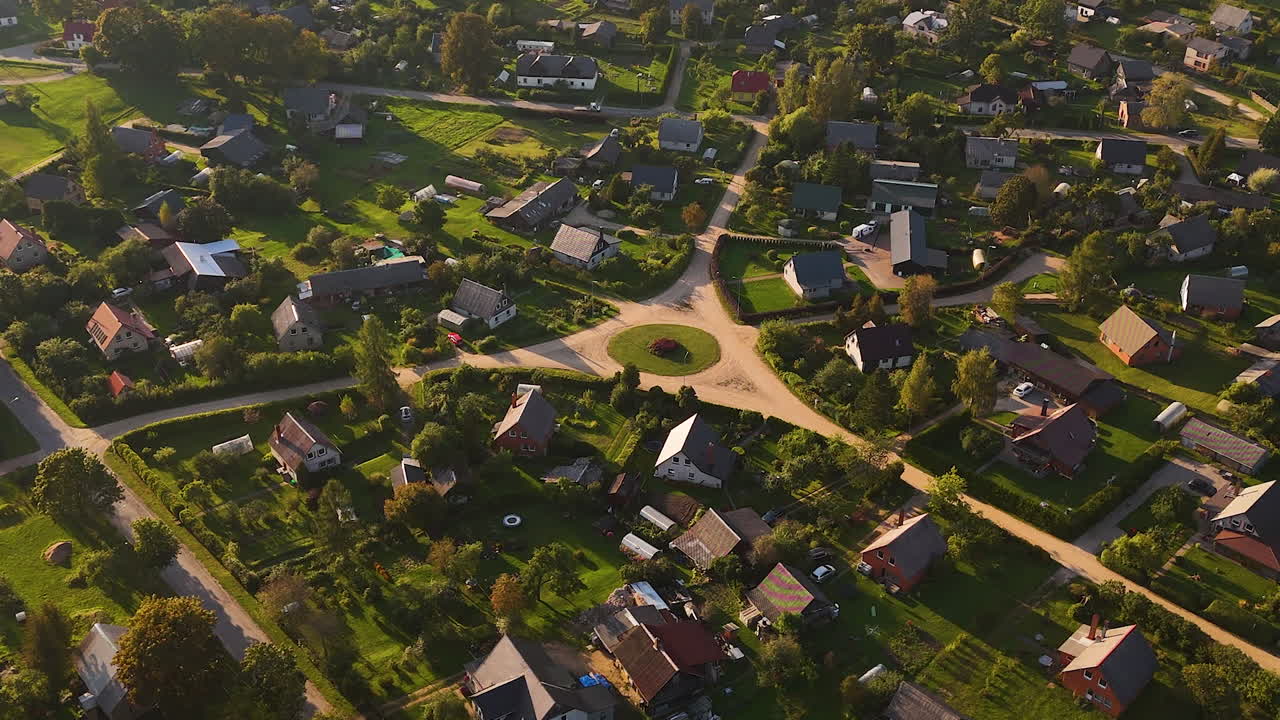 Countryside home of small town in Latvia, aerial orbit view