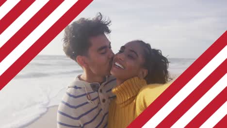 Animation-of-flag-of-united-states-of-america-over-biracial-couple-kissing-by-sea