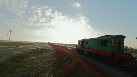 tren pasando por un paisaje rural al amanecer