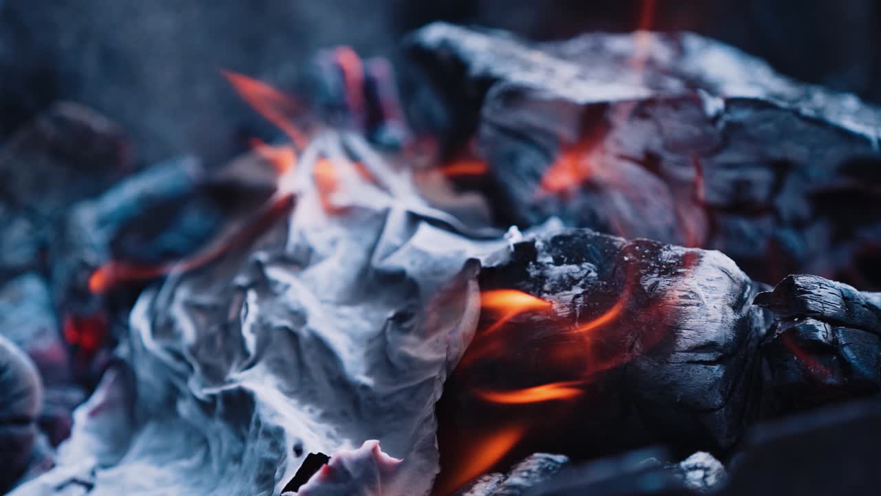 Burning paper. Bonfire. Burning logs in orange flames. Slow motion
