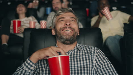 audience laughing at movie in theater