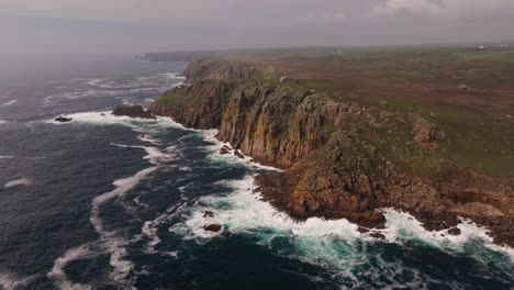 dramatic coastal cliffs and crashing waves at land's end