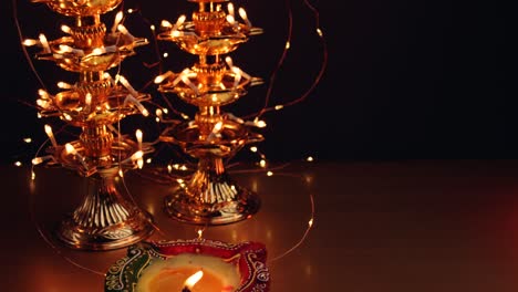 diyas being lit at diwali- festival of lights