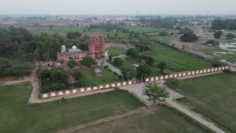 drone view of gurdwara rori sahib located in a small village called eminabad in punjab, pakistan