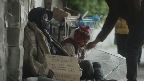 two street beggars having talk
